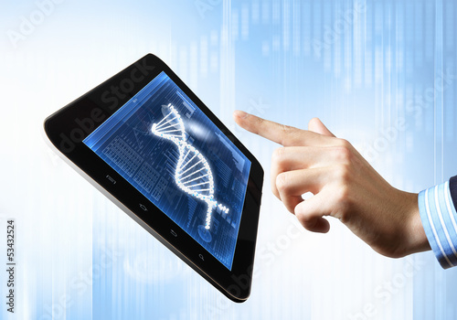Photo: Dna strand On The Tablet Screen Dna strand On The Tablet Screen