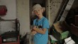 boy holding and stroking a kitten