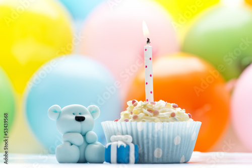Photo: Birthday cupcake with candle and sugar teddy Birthday cupcake with candle and sugar teddy
