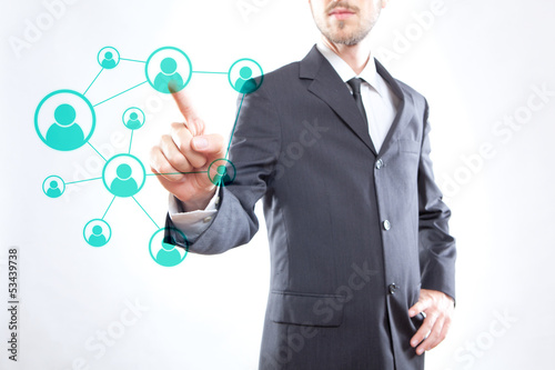 Photo: Businessman touching icons Businessman touching icons