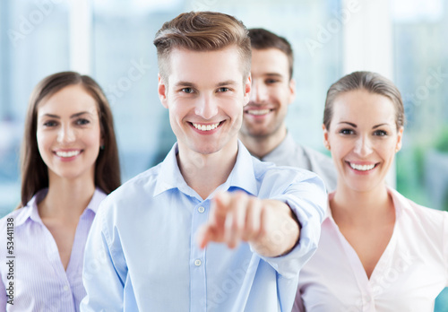 Photo: Business group pointing at you Business group pointing at you