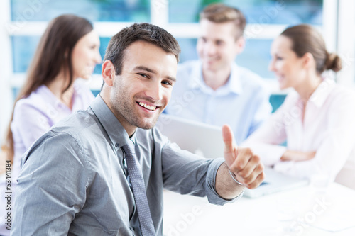 Photo: Businessman showing thumbs up Businessman showing thumbs up