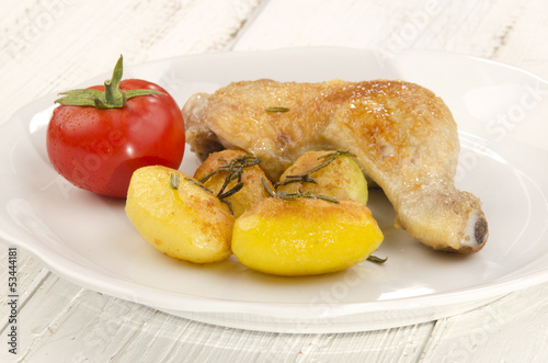 Photo: roasted potato and chicken drumstick roasted potato and chicken drumstick