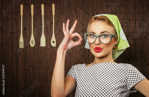 Photo: Happy woman cook with okay sign, close up Happy woman cook with okay sign, close up