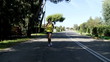 Woman running slow motion on street wide shot