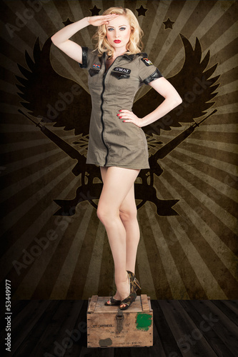 Photo: Attractive blond pin-up army girl. Military salute Attractive blond pin-up army girl. Military salute