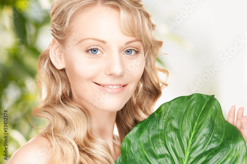 Photo: woman with green leaf woman with green leaf