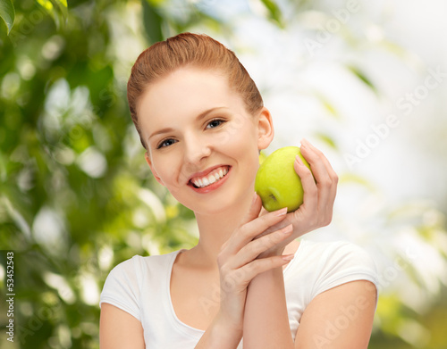 Photo: young beautiful woman with green apple young beautiful woman with green apple