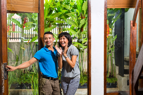 Photo: Asian couple moving in the new home Asian couple moving in the new home