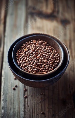 Photo: Brown lentils in ceramic bowls Brown lentils in ceramic bowls