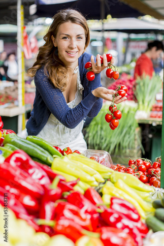 Photo: Young woman at the market Young woman at the market