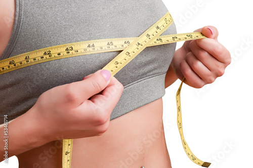 Photo: Woman Measuring Up Her Chest Woman Measuring Up Her Chest