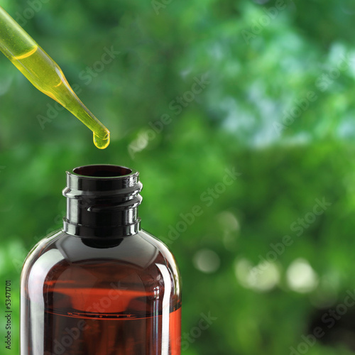 Photo: Dropper over essential oil bottle Dropper over essential oil bottle