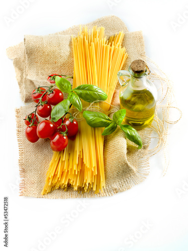 Photo: pasta spaghetti vegetables, spices and oil pasta spaghetti vegetables, spices and oil
