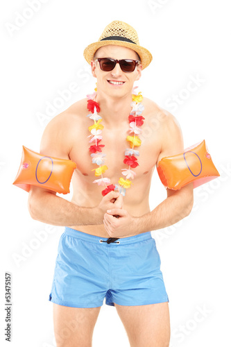 Photo: Guy in a swimsuit with swimming arm bands Guy in a swimsuit with swimming arm bands