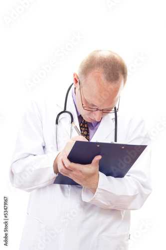 Photo: Male doctor making some important notes for diagnosis Male doctor making some important notes for diagnosis