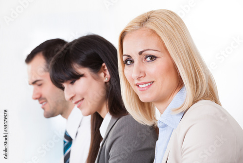 Photo: Close Up Of Happy Business People In A Row Close Up Of Happy Business People In A Row
