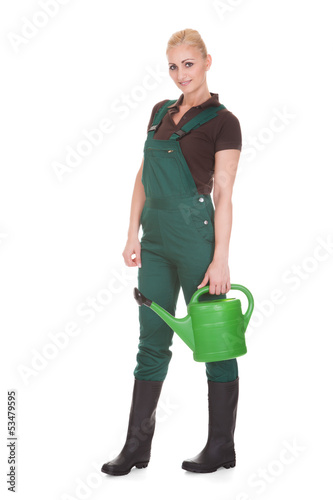 Photo: Portrait Of A Female Worker Holding Watering Can Portrait Of A Female Worker Holding Watering Can