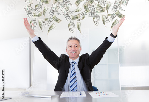 Photo: Mature Businessman Raising Arms Mature Businessman Raising Arms