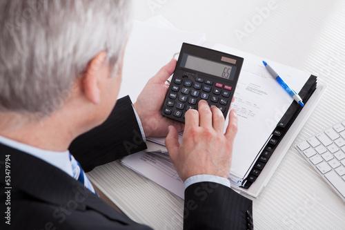 Photo: Mature Businessman At Work Mature Businessman At Work