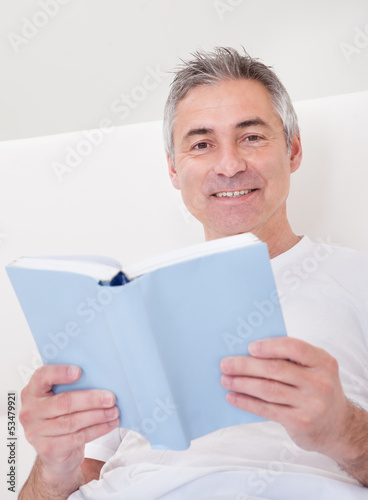 Photo: Mature Man Holding Book Mature Man Holding Book