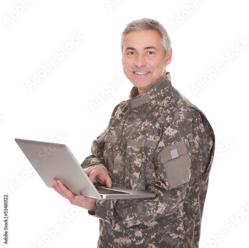 Photo: Mature Soldier Holding Laptop Mature Soldier Holding Laptop
