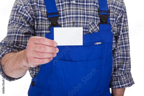 Photo: Mature Male Technician Holding Visiting Card Mature Male Technician Holding Visiting Card