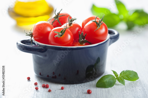 Photo: cherry tomatoes and basil in casserole cherry tomatoes and basil in casserole