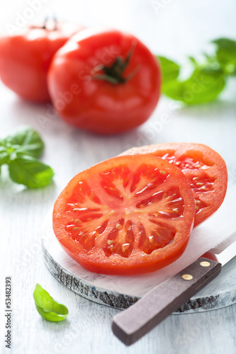 Photo: beef tomato sliced on cutting board beef tomato sliced on cutting board