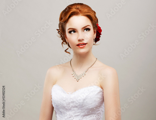 Photo: Sentimentality. Red Hair Woman with Flower in Head. Femininity Sentimentality. Red Hair Woman with Flower in Head. Femininity
