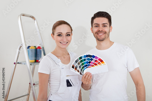 Photo: Young Couple With Color Samples Young Couple With Color Samples