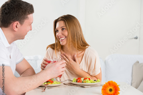 Photo: Happy couple eating vegetable salad Happy couple eating vegetable salad