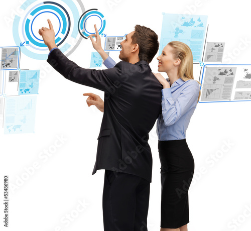 Photo: man and woman working with virtual screen man and woman working with virtual screen