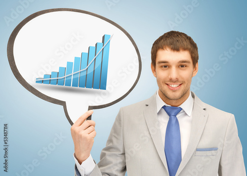 Photo: businessman holding text bubble with graph businessman holding text bubble with graph
