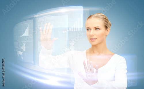 Photo: businesswoman touching virtual screen businesswoman touching virtual screen