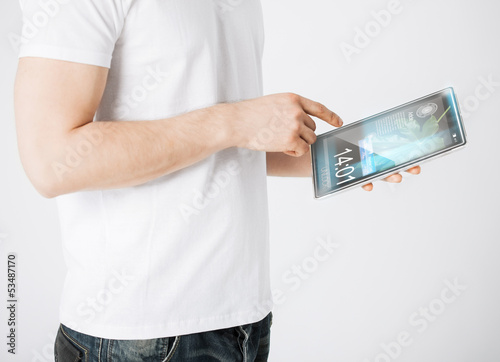 Photo: man with tablet pc reading news man with tablet pc reading news