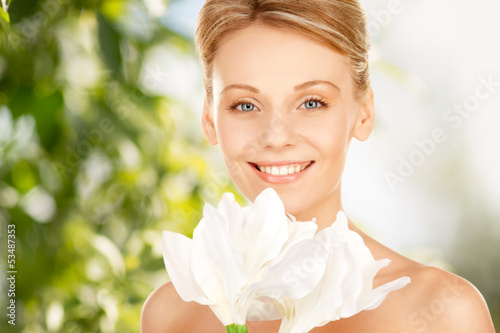 Photo: lovely woman with lily flower lovely woman with lily flower