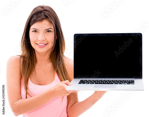Photo: Woman holding a laptop Woman holding a laptop