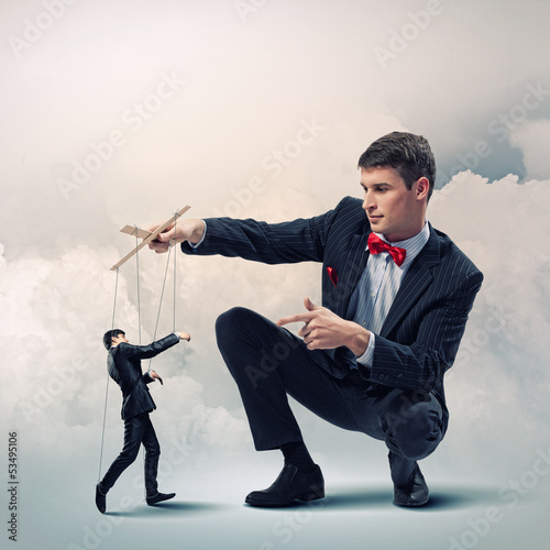 Photo: Businessman puppeteer Businessman puppeteer