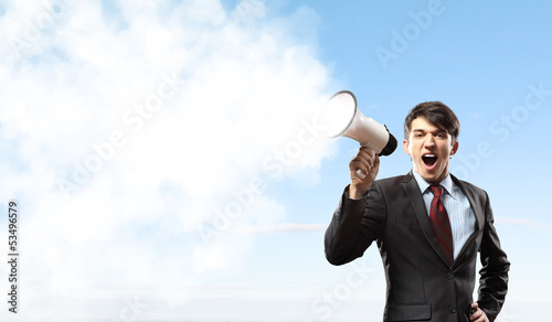 Photo: businessman with megaphone businessman with megaphone
