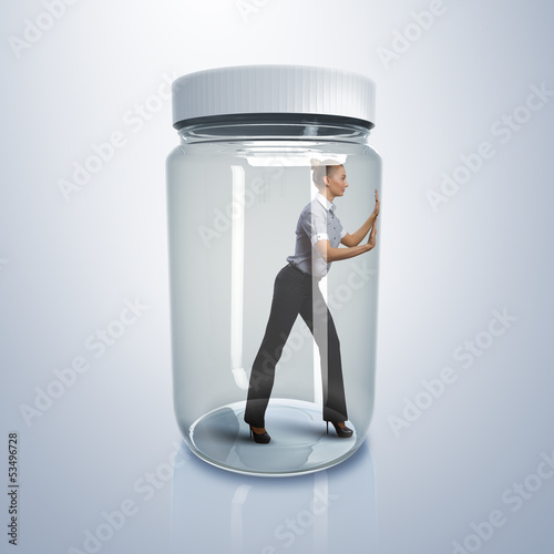 Photo: Businesswoman inside glass jar Businesswoman inside glass jar