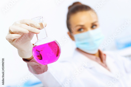Photo: Young female scientist working in laboratory Young female scientist working in laboratory