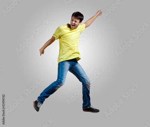 Photo: Young man dancing and jumping Young man dancing and jumping