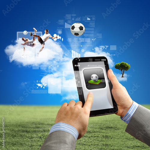 Photo: Close-up of man hands holding tablet pc Close-up of man hands holding tablet pc