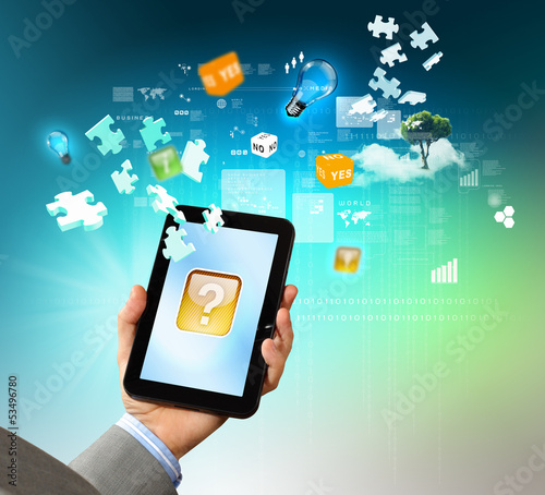 Photo: Close-up of hands holding tablet pc Close-up of hands holding tablet pc