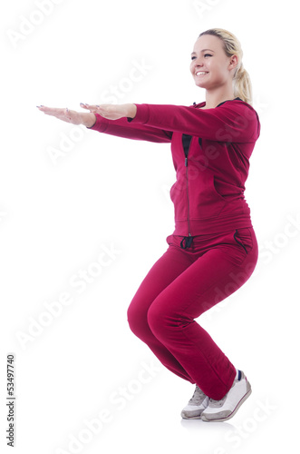 Photo: Young woman doing exercises on white Young woman doing exercises on white