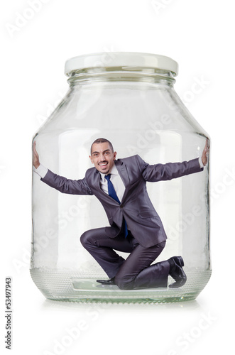 Photo: Young businessman in glass jar Young businessman in glass jar