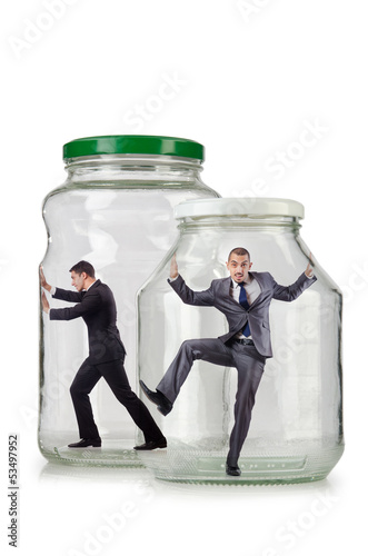 Photo: Young businessman in glass jar Young businessman in glass jar