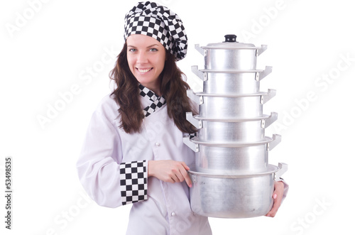 Photo: Cook with stack of pots on white Cook with stack of pots on white