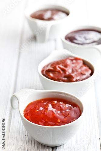 Photo: various barbecue sauces in ceramic bowls various barbecue sauces in ceramic bowls